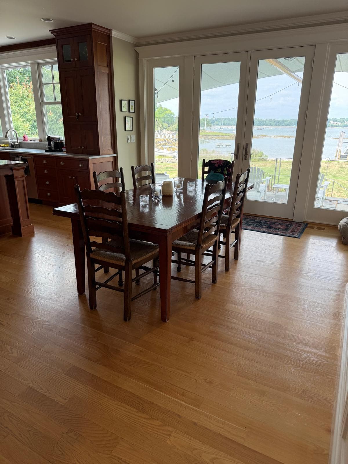 A clean kitchen and dining area in a waterfront South Shore home